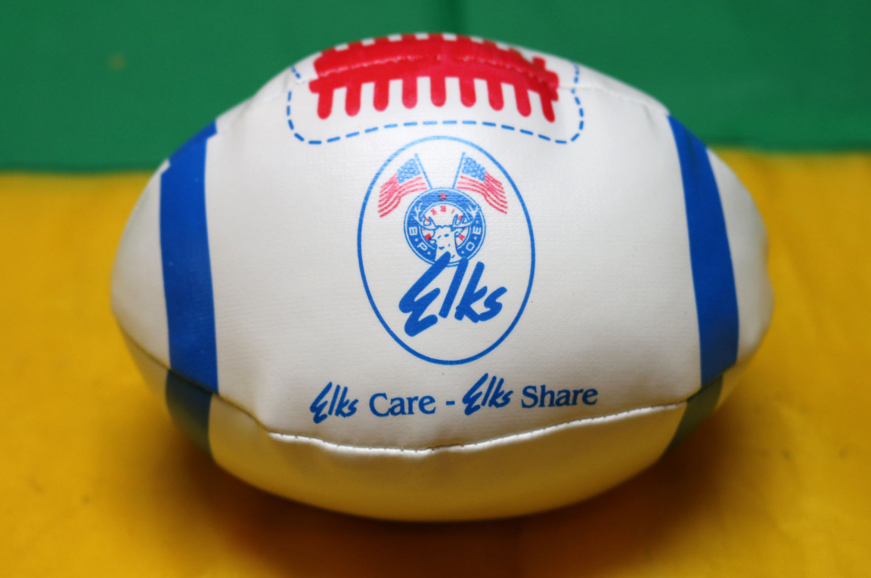 Krewe of Elks Orleans throws: Elroy the Elk, footballs and medallions